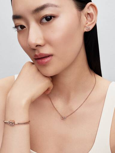 Infinity heart 14k rose gold-plated stud earrings with clear cubic zirconia